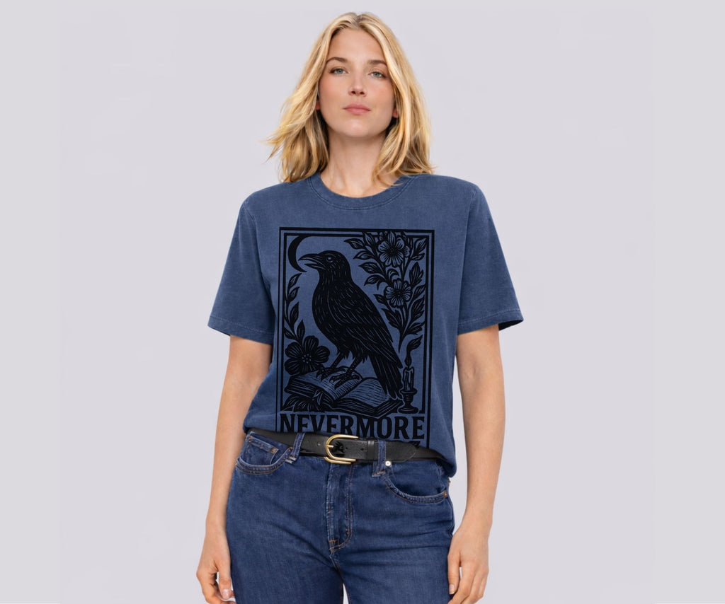 Woman wearing Comfort Colors Edgar Allan Poe Nevermore raven linocut shirt with dark academia gothic book lover graphic
