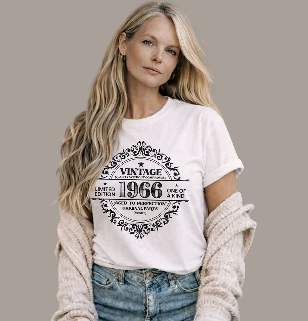 Vintage 1966 limited edition birthday shirt on a white Bella Canvas t-shirt worn with blue jeans and cardigan