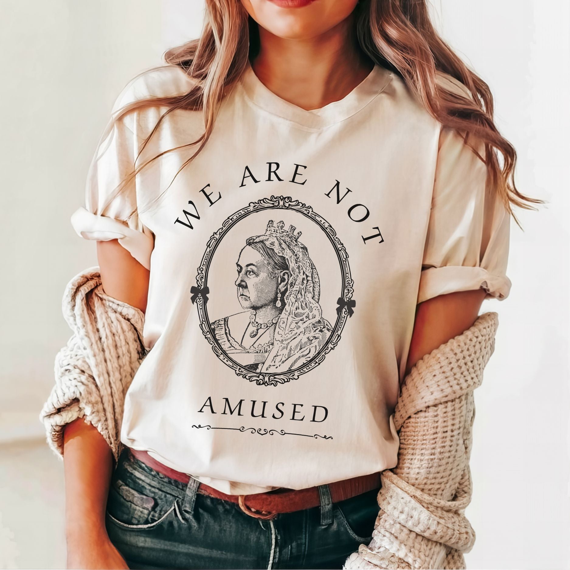 We Are Not Amused Queen Victoria quote shirt in soft pink worn by female model